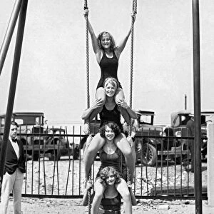 Four Girls On A Swing Set