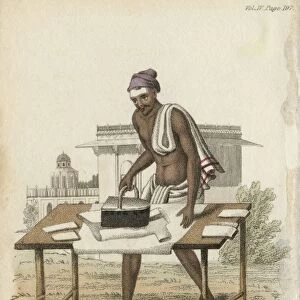 Indian using iron filled with hot charcoal to press clothes. Hand-coloured engraving