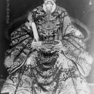 A Mandarin, full length portrait of old man in ceremonial dress facing front, Saigon Vietnam, c1910