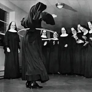 Nun Swivels Hula Hoop On Hips