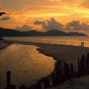 Two people on Ferenghi beach at sunset, Penang Malaysia 3