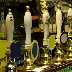 Row of beer taps in pub
