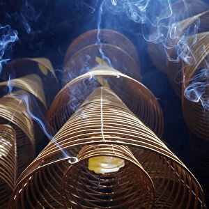 Taoist Ong pagoda. Incense coils hang from the ceiling. Can Tho. Vietnam