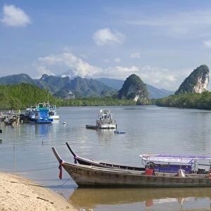 Thailand, Krabi, Krabi Town, riverfront with Khao Khanap Nam in the background