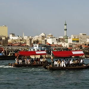 United Arab Emirates, Dubai, people travelling in Abras water taxis on Dubai Creek