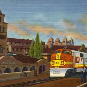 Il Treno di Santa Fe all'Albuquerque Depot. ca. 1939, Albuquerque, Nuovo Messico, USA, A-27 SANTA FE SUPER CHIEF AD ALBUQUERQUE, NUOVO MESSICO. Un treno a flusso laminato di alta velocità della Santa Fe Ry davanti al Deposito e Hotel Alvarado pronto a pro Il Treno di Santa Fe all'Albuquerque Depot. ca. 1939, Albuquerque, Nuovo Messico, USA, A-27 SANTA FE SUPER CHIEF AD ALBUQUERQUE, NUOVO MESSICO. Un treno a flusso laminato di alta velocità della Santa Fe Ry davanti al Deposito e Hotel Alvarado pronto a pro