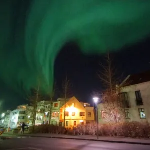 Reykjavik modern architecture apartment blocks and aurora borealis northern lights