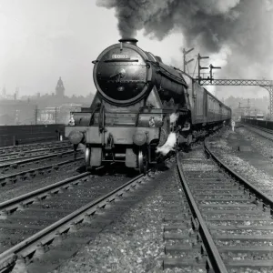 Flying Scotsman A3 Class steam locomotive leaving Leeds station, 1956