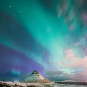 Aurora Borealis over Kirkjufell Mountain Iceland