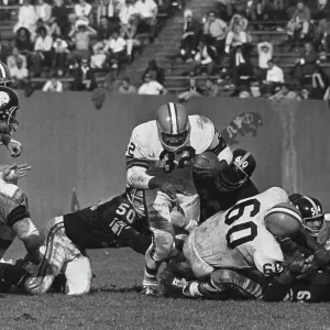 Jim Brown Stepping Over a Tackle in 1964 Print Jim Brown Stepping Over a Tackle in 1964 Print