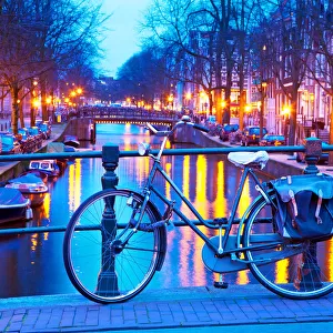 A bicycle on a bridge at dusk, Amsterdam