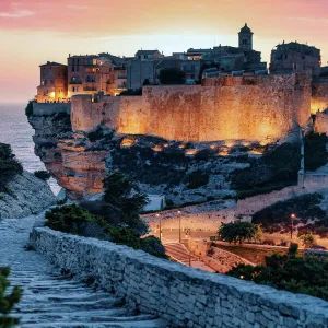 Bonifacio, Corsica, France. Sunset over cliffs and town