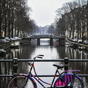 A Dutch Bicycle Parked on an Amsterdam Canal Bridge