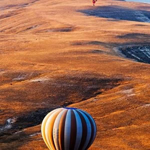 Hot air balloon over beautiful landscape