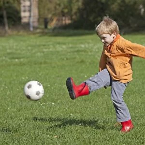 Little boy playing soccer