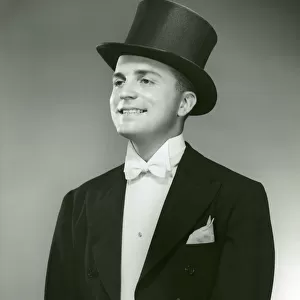 Man in top hat, white tie and tails