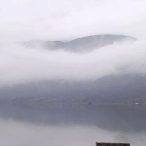Mist over Lake Bohinj in autumn, Slovenia, Europe