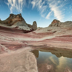Pool reflection and sandstone landscape, Vermillion Cliffs, White Pocket wilderness, Arizona, USA