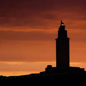 Silhouette of Hercules Tower at orange sunset