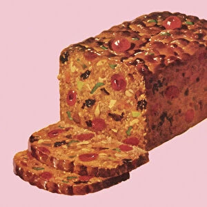 Traditional fruitcake with slices set on a pink background