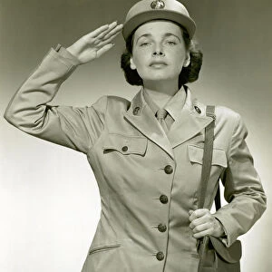 Woman in uniform saluting