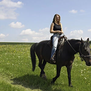 Young woman riding on horseback, Bavaria, Germany, Europe