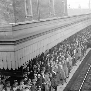A crowded station platform full of Dartford supporters en route to the match between