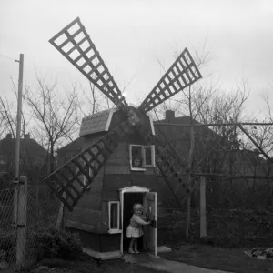 Five-year-old Denise Holmes and her sister Nicola, two, now have a windmill at