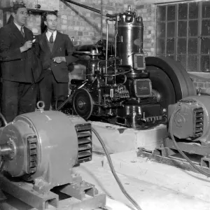 Generators at the Commodore Cinema, Orpington, Kent in the 1930s, with cinema staff looking