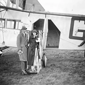 The honeymoon express. Pilot Officer Whinney, RAF, who married Miss Edna Moodie