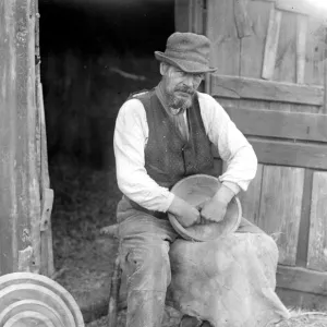 Mr George Lailey engaged in the ancient craft of wooden bowl making at Bucklebury, Berks