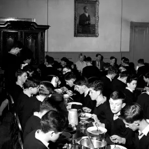 An oil painting of Prince Philip - an old boy of the school - looks down on the dining