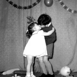 A Little Boy and Girl Kissing Under the Mistletoe Print A Little Boy and Girl Kissing Under the Mistletoe Print
