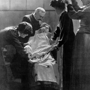 A woman Suffragette prisoner being force fed with a tube 1912