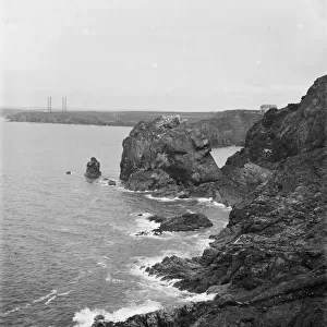 A distant view of the four wooden Marconi wireless towers at Poldhu, Mullion, Cornwall from Mullion Cove along the cliff. 1908