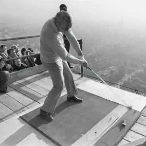 American Golfer Arnold Palmer kicks off from the second floor of the Eiffel Tower