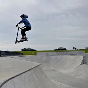 A boy rides a scooter in a skate park on October 7, 2016 in Saint-Nazaire, western France