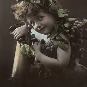 Child with bunches of grapes (colour photo)