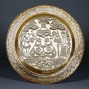 An Efik brass charger embossed with a central robed female figure
