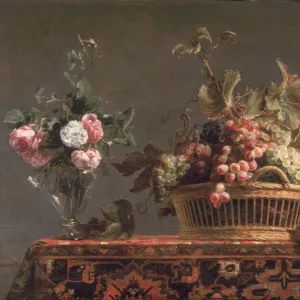 Grapes in a basket and roses in a vase