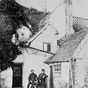 Two men outside Enfield cottage, c. 1890 (b / w photo)