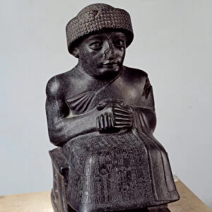 Mesopotamia: statue of the god Ningishzida representing Gudea sitting, prince of Lagash