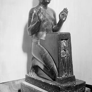 Naophorous statue of a man (basalt)