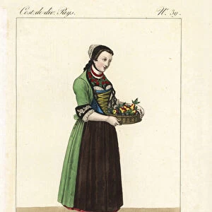 Young girl of the Canton of Thurgau, Switzerland, 19th century. Her little cap, gorget and sleeve cuffs are all of painted cloth. She carries a basket of pears, plums and apples, the main product of the area