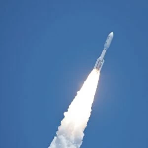 An Atlast V rocket carrying the Juno spacecraft during a midday launch