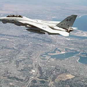 An F-14A Tomcat cruises above San Diego, California