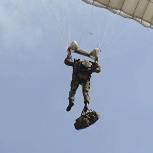 A member of the Pathfinder Platoon prepares to land from a parachute jump