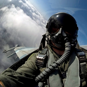 A pilot in the cockpit of an F-16 Fighting Falcon