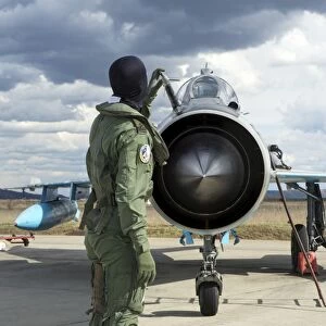 Romanian Air Force pilot checking his MiG-21 Lancer