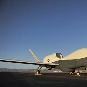 An RQ-4 Global Hawk unmanned aerial vehicle sits on the flight line